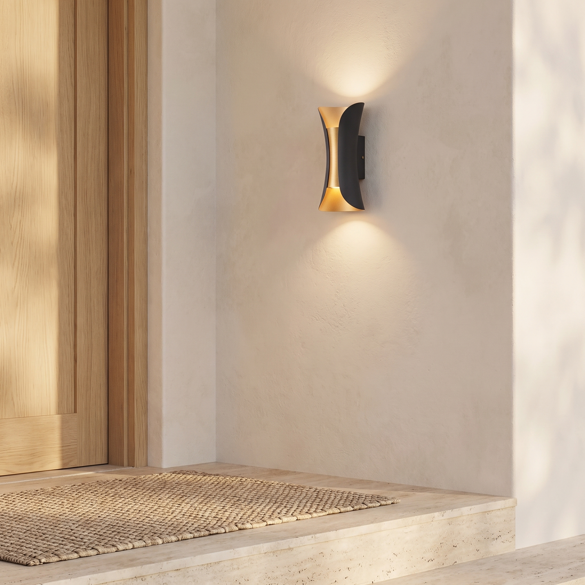 Arcelle sconce on a cream limewash entry facade