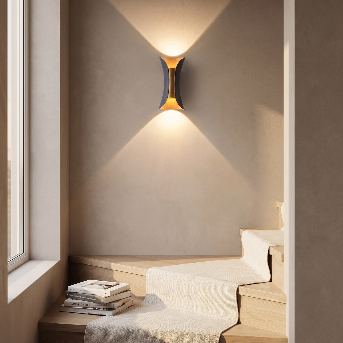Arcelle sconce on a limewash stairwell wall above oak treads