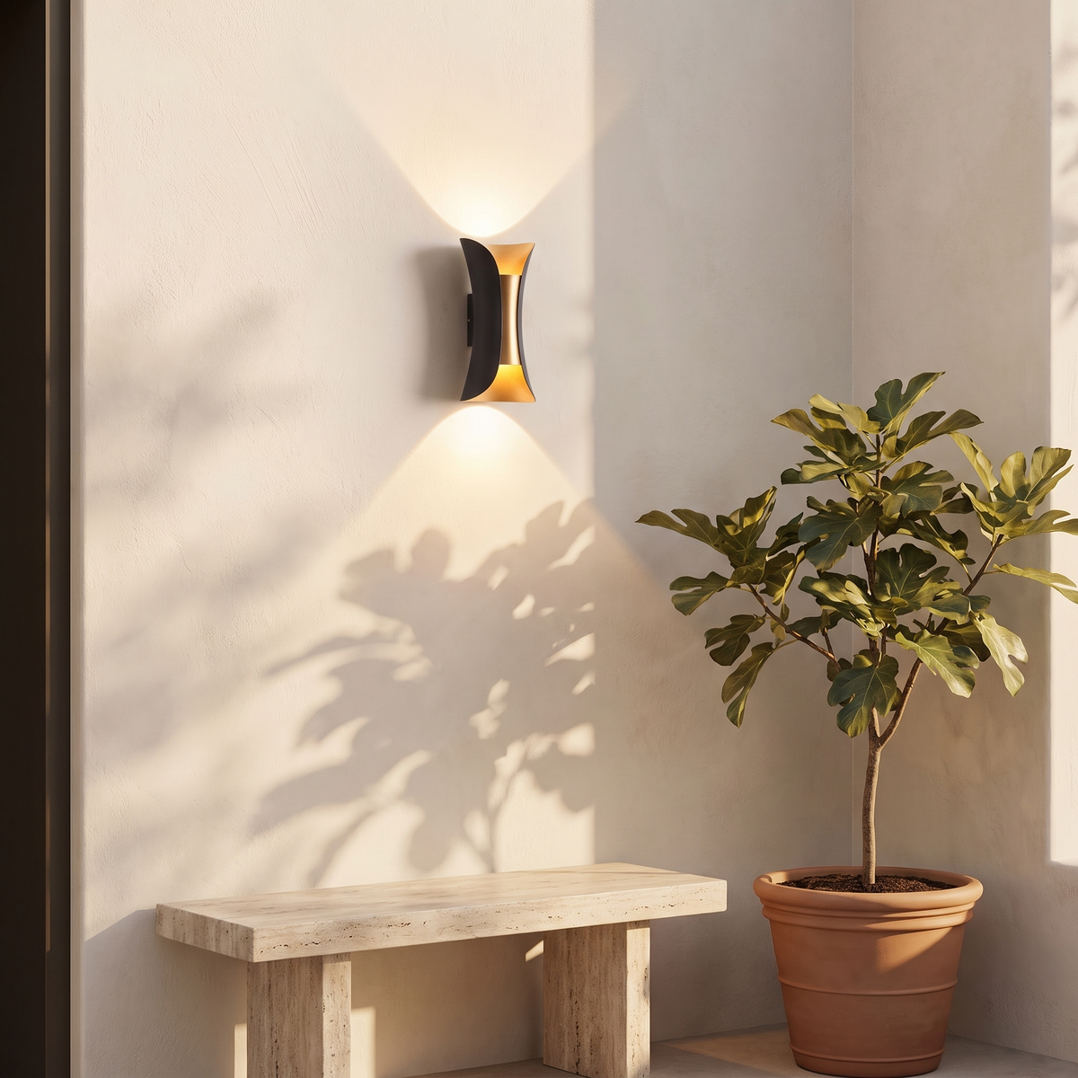 Arcelle sconce on a courtyard wall beside a travertine bench