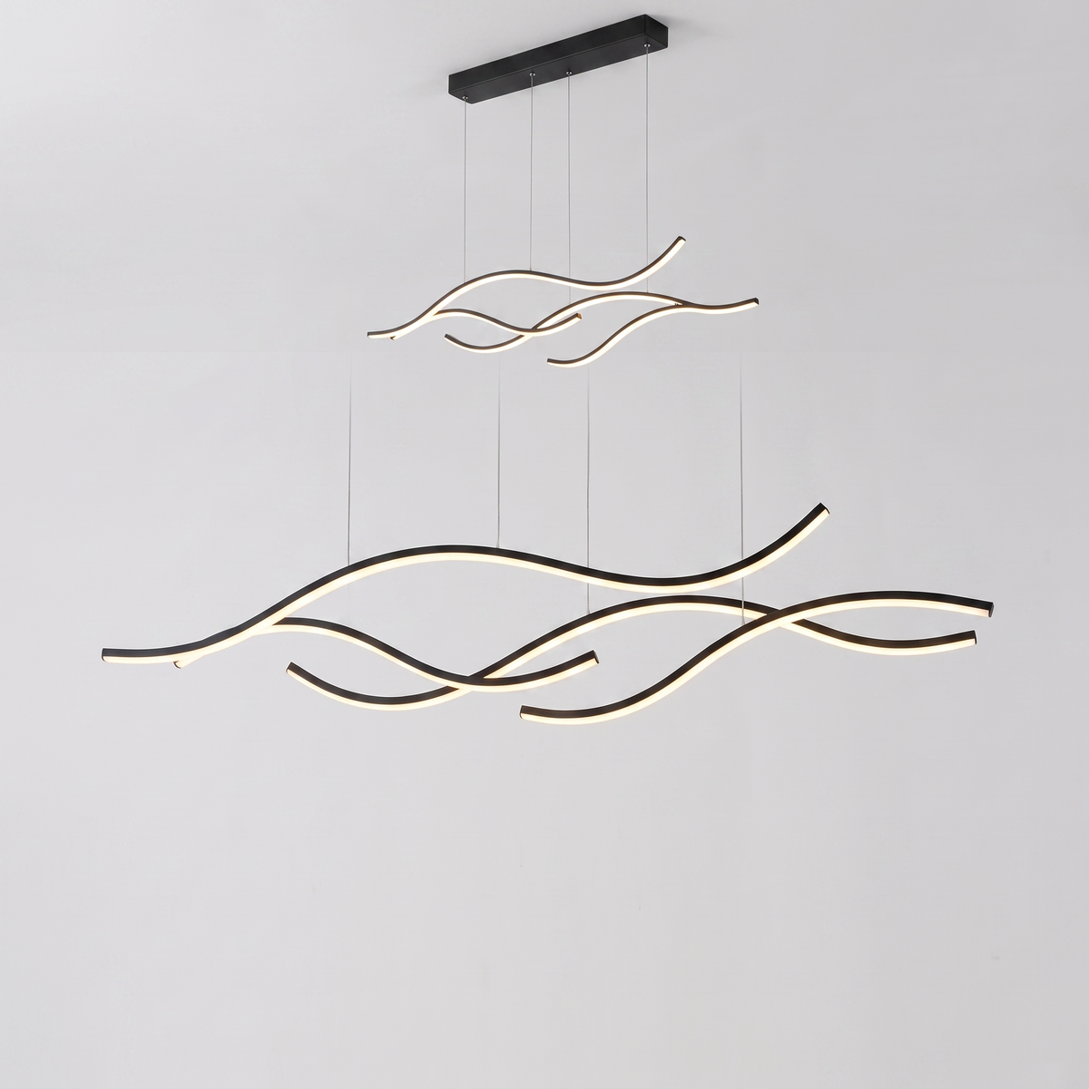 Ondelle wavy curved LED pendant on a white background