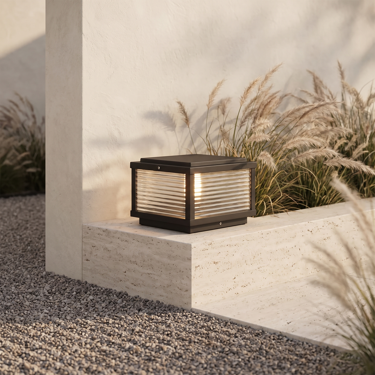 Solvane pillar light beside a raked gravel garden path