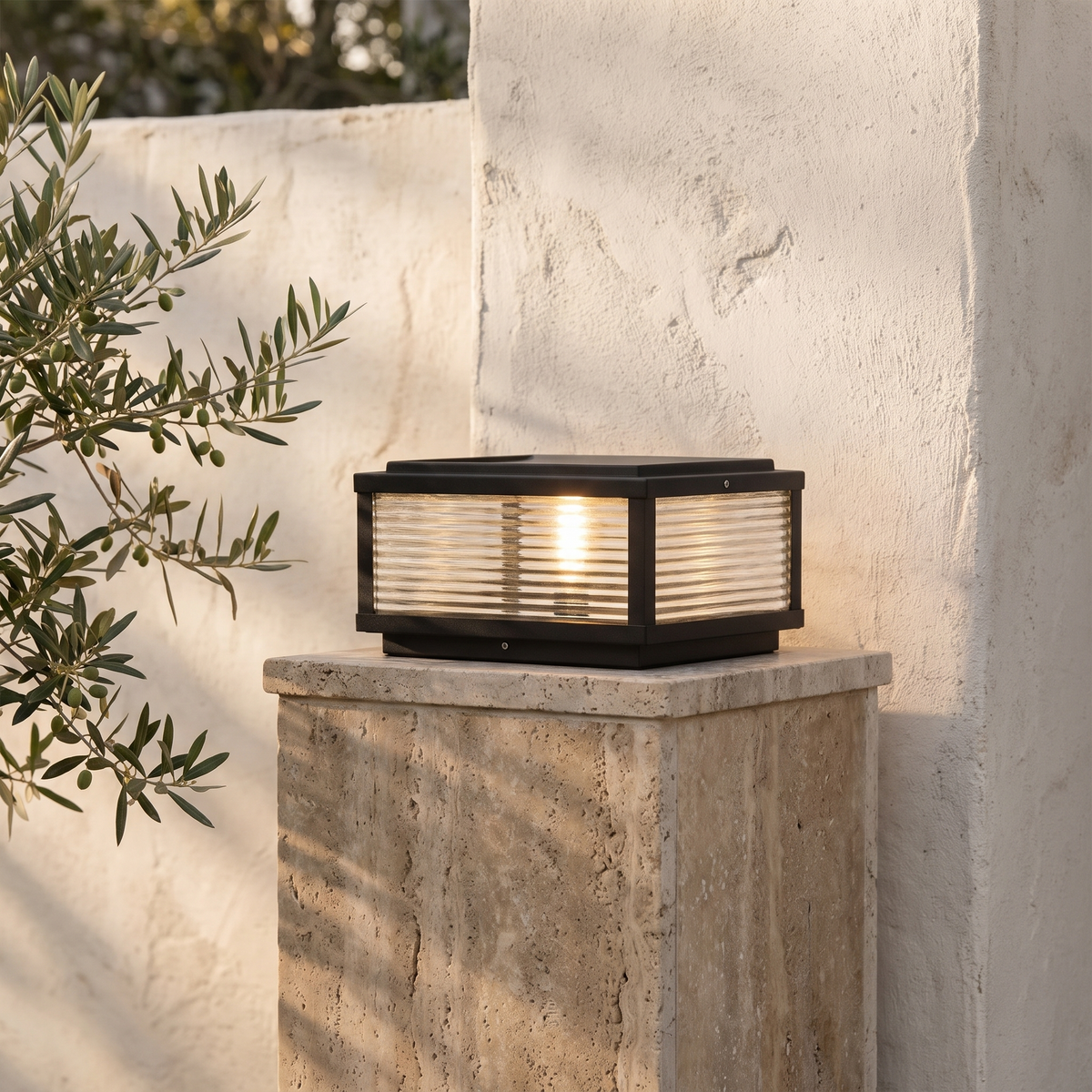 Solvane pillar light on a travertine gate pillar