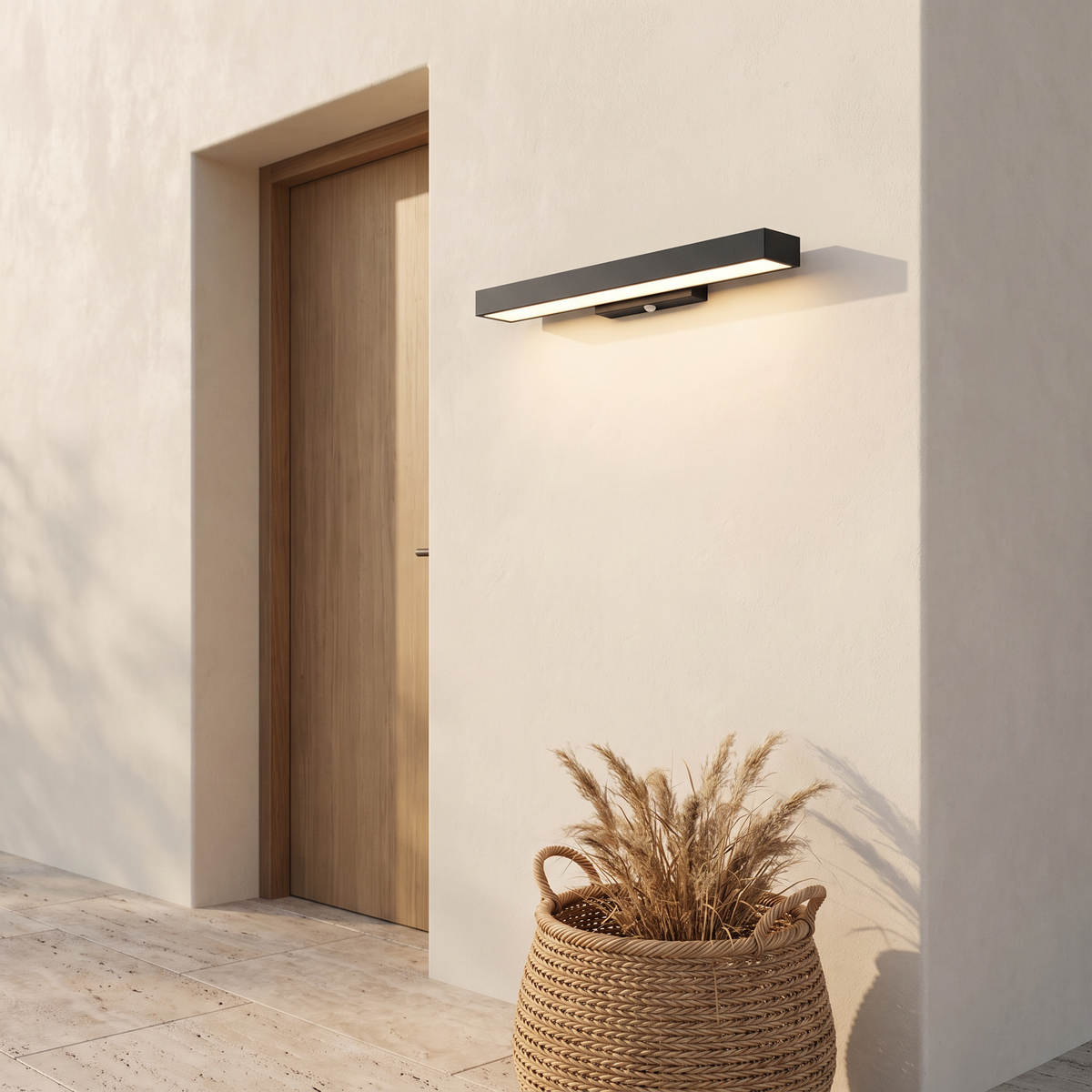 Marquel wall light beside a side entry door on a cream plaster wall