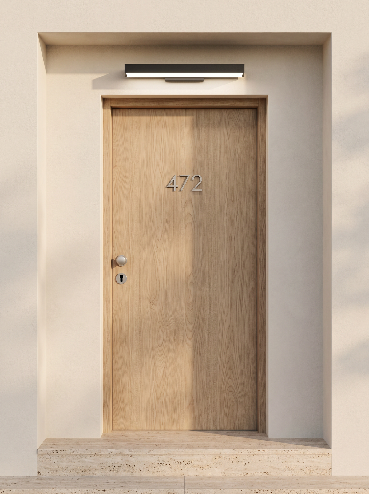 House numbers and keyhole legible under the neutral white beam of the Marquel