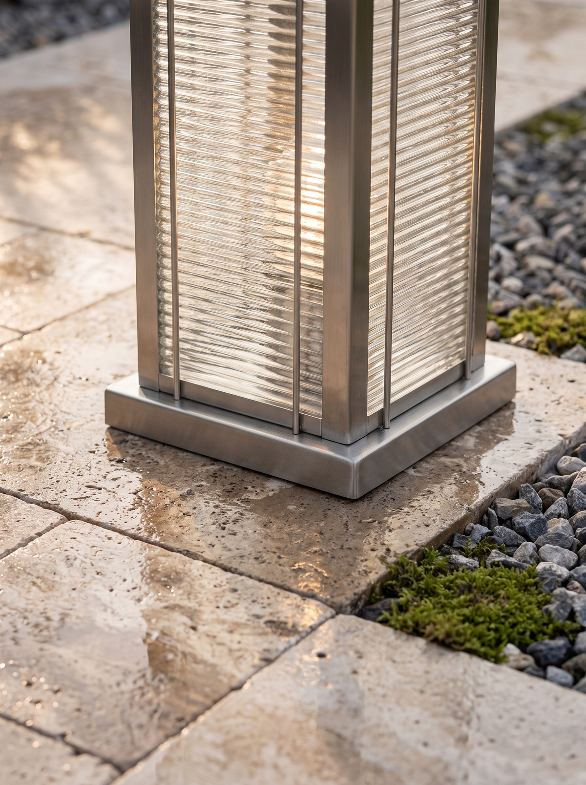Solvane pillar light stainless steel base meeting damp travertine paving